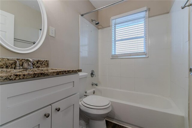 2329 Meadowlane Dr SW, Atlanta, GA 30311 - full bathroom featuring vanity, tiled shower / bath combo, and toilet