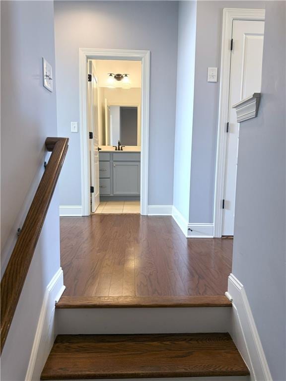 interior space featuring baseboards and wood finished floors