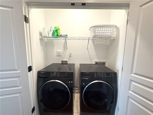 laundry area with laundry area and washing machine and dryer