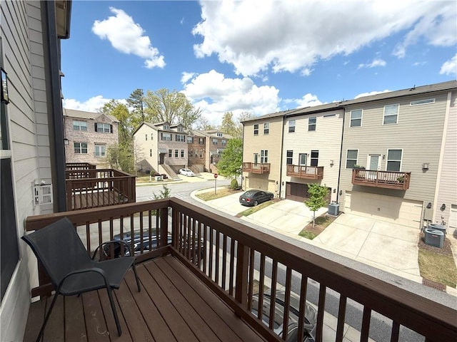 wooden deck featuring a residential view