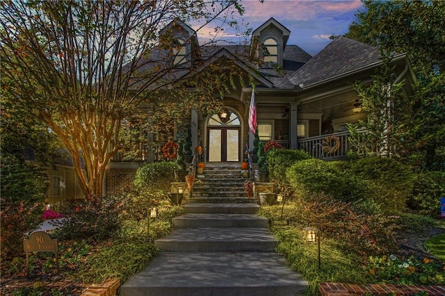 view of exterior entry at dusk