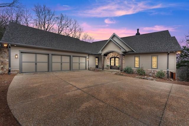 ranch-style house featuring a garage