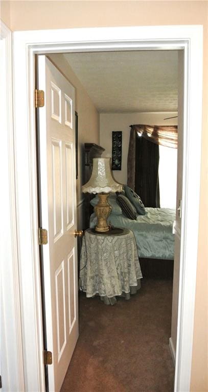 bedroom with dark carpet