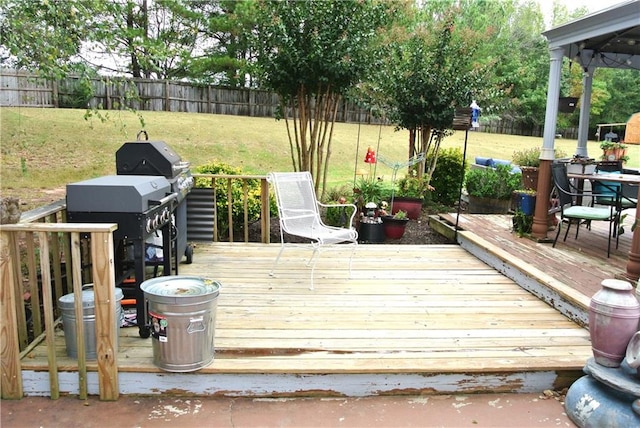 wooden deck with a yard