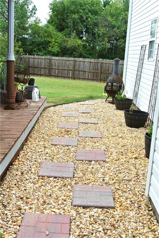 view of yard featuring a wooden deck