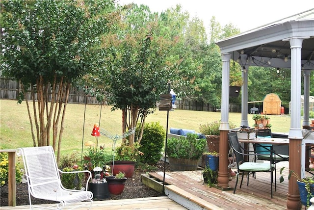 exterior space featuring a gazebo and a deck