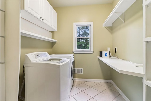 150 Henderson Farm Dr, Woodstock, GA 30188 - laundry room featuring cabinet space, independent washer and dryer, and light tile patterned floors