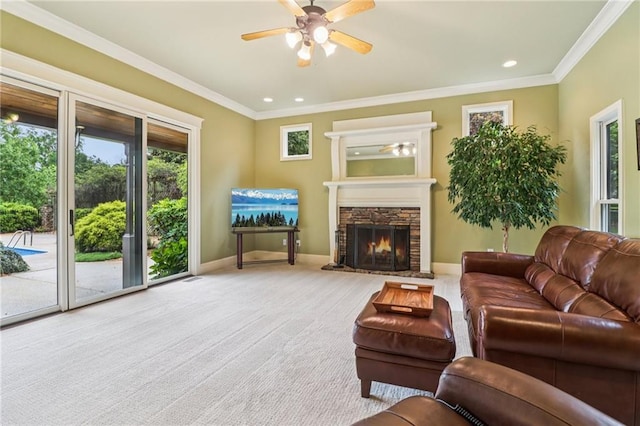 150 Henderson Farm Dr, Woodstock, GA 30188 - living room featuring a ceiling fan, ornamental molding, a stone fireplace, carpet, and recessed lighting