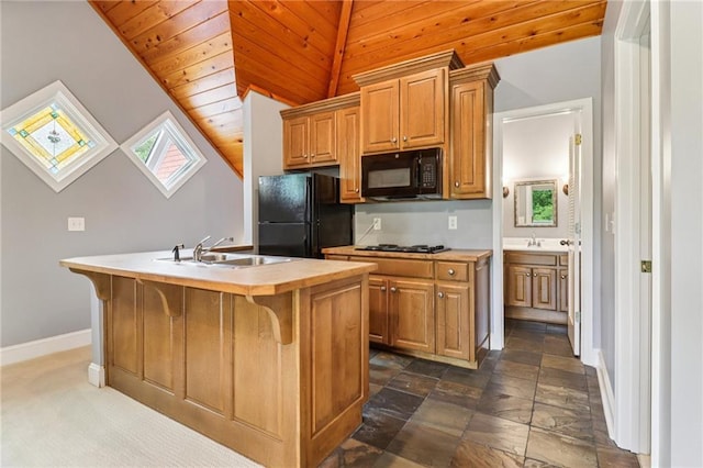 150 Henderson Farm Dr, Woodstock, GA 30188 - kitchen with black appliances, a center island with sink, light countertops, wooden ceiling, and a kitchen breakfast bar