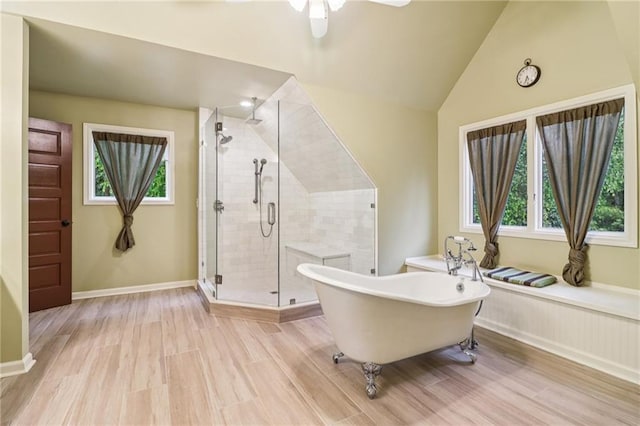 150 Henderson Farm Dr, Woodstock, GA 30188 - full bathroom with a soaking tub, a stall shower, plenty of natural light, vaulted ceiling, and a ceiling fan