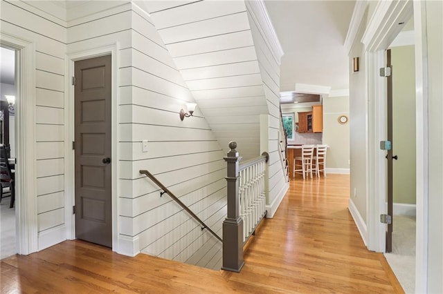 150 Henderson Farm Dr, Woodstock, GA 30188 - hall with an upstairs landing, light wood-style flooring, and crown molding