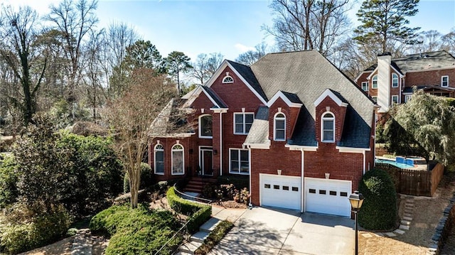 389 Mill Creek Bnd NE, Atlanta, GA 30307 - view of front of property with brick siding, driveway, and a garage