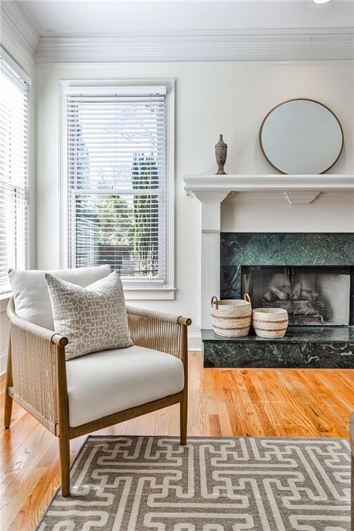 389 Mill Creek Bnd NE, Atlanta, GA 30307 - sitting room featuring ornamental molding, wood finished floors, and a healthy amount of sunlight