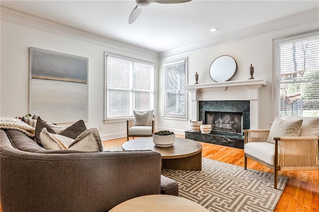 389 Mill Creek Bnd NE, Atlanta, GA 30307 - living area featuring crown molding, a ceiling fan, wood finished floors, and a premium fireplace