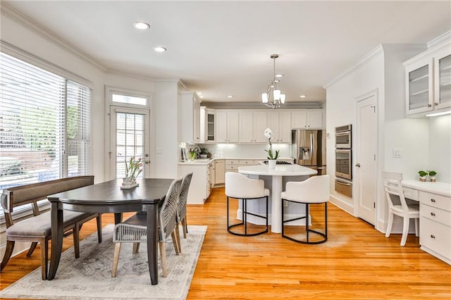 389 Mill Creek Bnd NE, Atlanta, GA 30307 - dining room featuring recessed lighting, ornamental molding, light wood-style flooring, and a chandelier