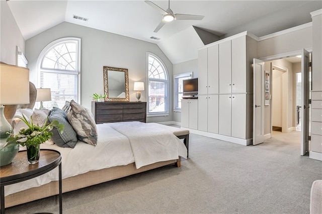 389 Mill Creek Bnd NE, Atlanta, GA 30307 - bedroom featuring visible vents, multiple windows, lofted ceiling, and light carpet