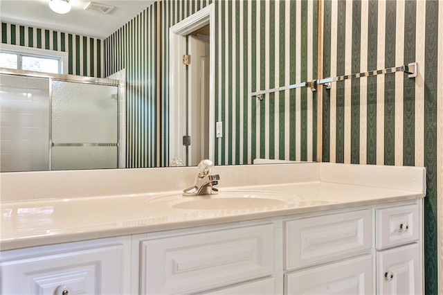 389 Mill Creek Bnd NE, Atlanta, GA 30307 - full bath featuring wallpapered walls, visible vents, a shower with shower door, and vanity