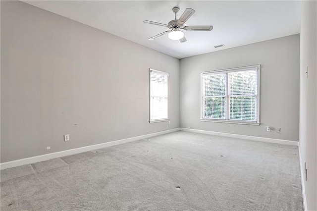 389 Mill Creek Bnd NE, Atlanta, GA 30307 - spare room with carpet flooring, baseboards, visible vents, and ceiling fan
