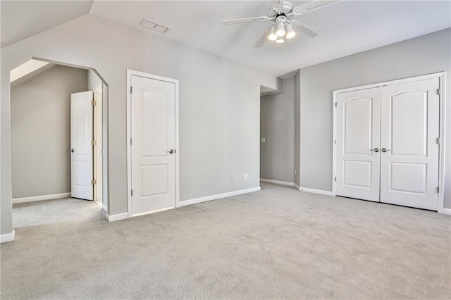 389 Mill Creek Bnd NE, Atlanta, GA 30307 - unfurnished bedroom with ceiling fan, visible vents, vaulted ceiling, baseboards, and carpet