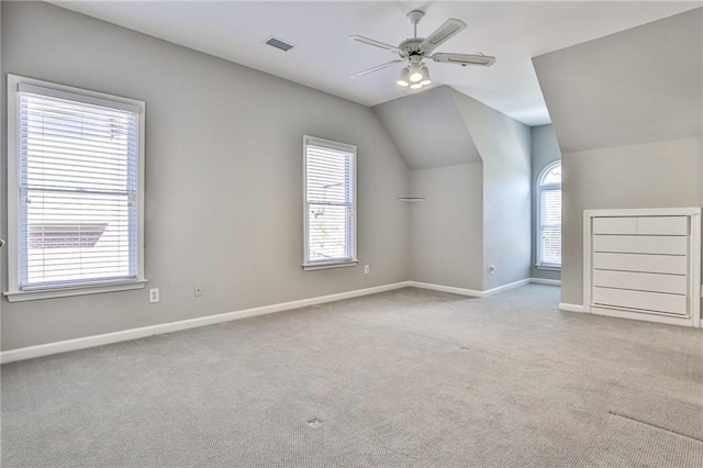 389 Mill Creek Bnd NE, Atlanta, GA 30307 - additional living space featuring a ceiling fan, visible vents, vaulted ceiling, baseboards, and carpet flooring