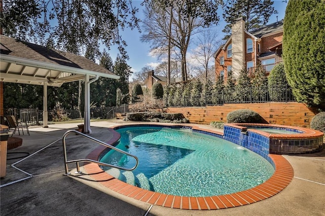 389 Mill Creek Bnd NE, Atlanta, GA 30307 - view of swimming pool with an in ground hot tub, a gazebo, a fenced in pool, a fenced backyard, and a patio