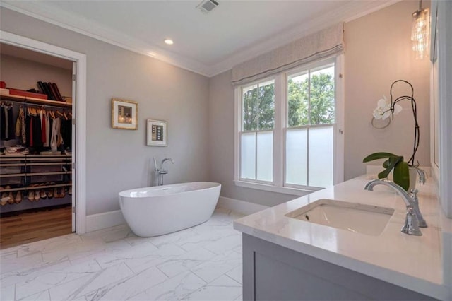 2010 Georgia Club Dr, Statham, GA 30666 - full bathroom featuring ornamental molding, vanity, a freestanding tub, plenty of natural light, and marble finish flooring