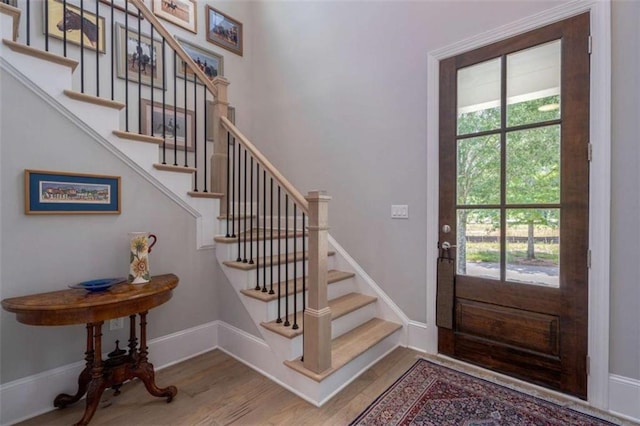 2010 Georgia Club Dr, Statham, GA 30666 - entryway with wood finished floors and stairway