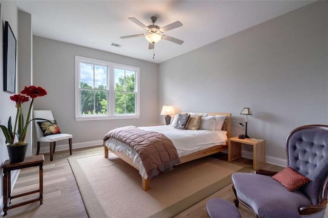 2010 Georgia Club Dr, Statham, GA 30666 - bedroom with light wood finished floors and ceiling fan