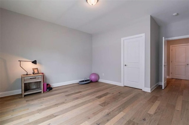 2010 Georgia Club Dr, Statham, GA 30666 - unfurnished bedroom featuring wood finished floors and baseboards