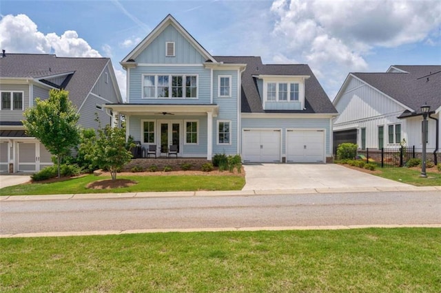 2010 Georgia Club Dr, Statham, GA 30666 - view of front of home featuring driveway, board and batten siding, covered porch, and a garage