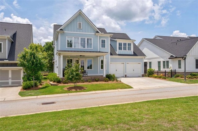 2010 Georgia Club Dr, Statham, GA 30666 - view of front of property featuring driveway, board and batten siding, a porch, and an attached garage