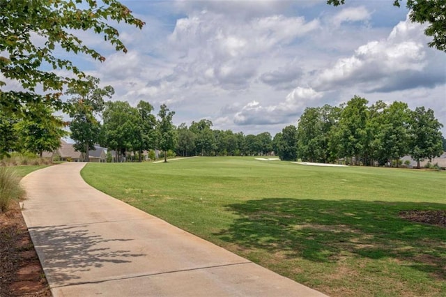 2010 Georgia Club Dr, Statham, GA 30666 - view of community with a lawn, view of golf course, and concrete driveway