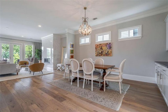 2010 Georgia Club Dr, Statham, GA 30666 - dining room with crown molding, hardwood / wood-style flooring, recessed lighting, and a chandelier