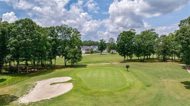 2010 Georgia Club Dr, Statham, GA 30666 - surrounding community featuring view of golf course, view of scattered trees, and a lawn
