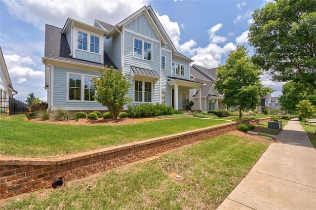 2010 Georgia Club Dr, Statham, GA 30666 - view of front of property with board and batten siding and a front lawn