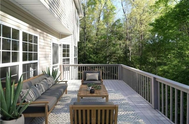 wooden terrace with outdoor lounge area