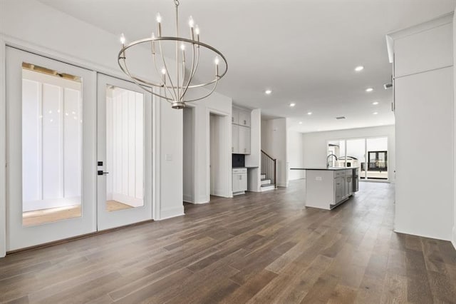 interior space featuring sink, a chandelier, and dark hardwood / wood-style flooring