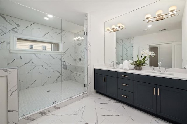 bathroom with tile patterned flooring, dual vanity, and a shower with shower door