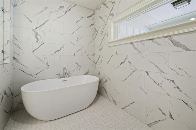 bathroom featuring tile patterned flooring and tile walls