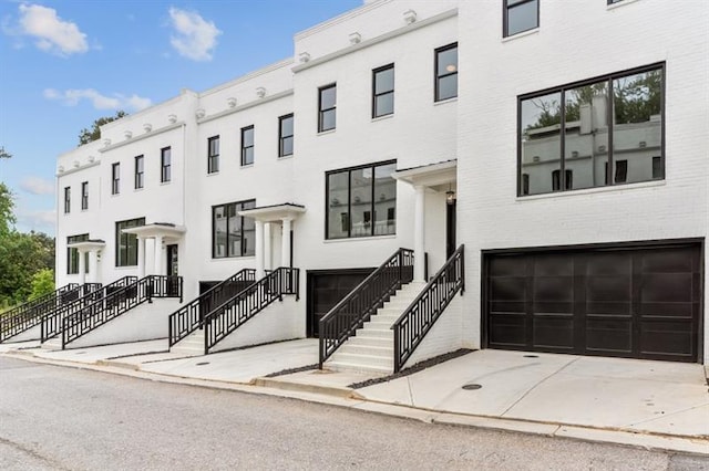 townhome / multi-family property featuring a garage