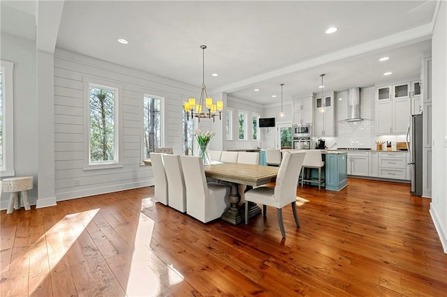 dining room featuring an inviting chandelier and hardwood / wood-style flooring