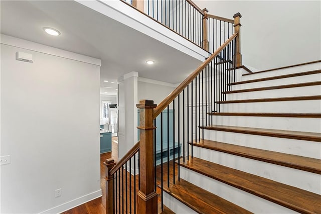 staircase featuring wood-type flooring