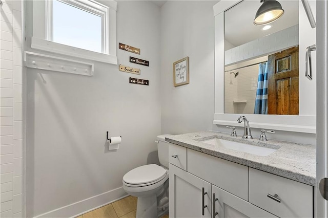 bathroom with vanity, curtained shower, and toilet