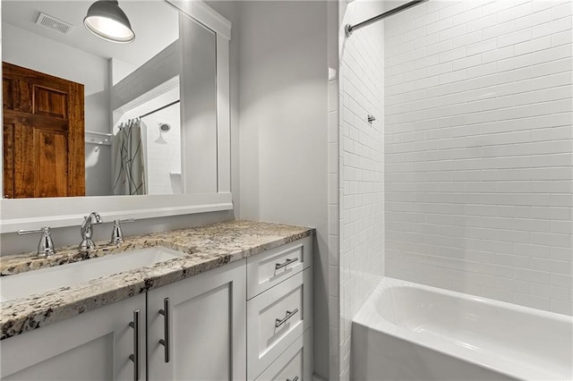 bathroom with vanity and shower / bath combo with shower curtain