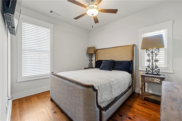 bedroom featuring dark wood-type flooring and ceiling fan