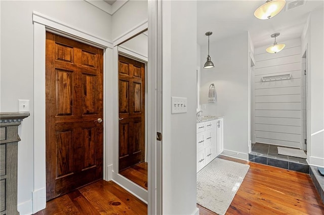 foyer with dark hardwood / wood-style flooring