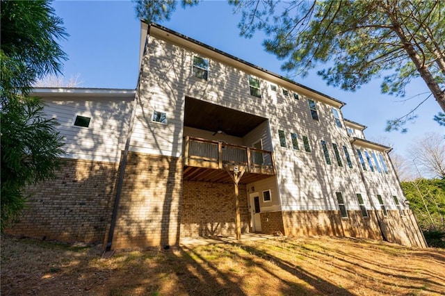 rear view of house featuring a balcony