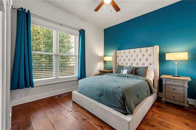 bedroom featuring hardwood / wood-style floors and ceiling fan