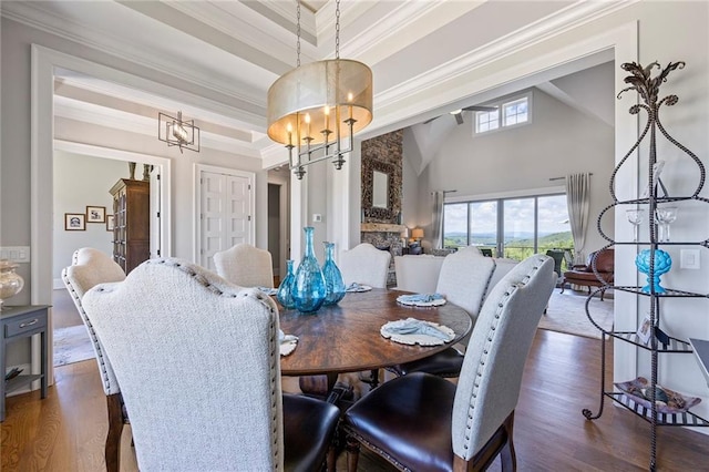 living area with a ceiling fan, dark wood-style floors, a wealth of natural light, and a fireplace