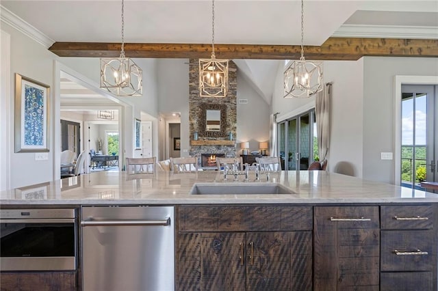 living area with crown molding, high vaulted ceiling, ceiling fan with notable chandelier, and wood finished floors